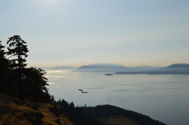 Sunlight over mountains and ocean